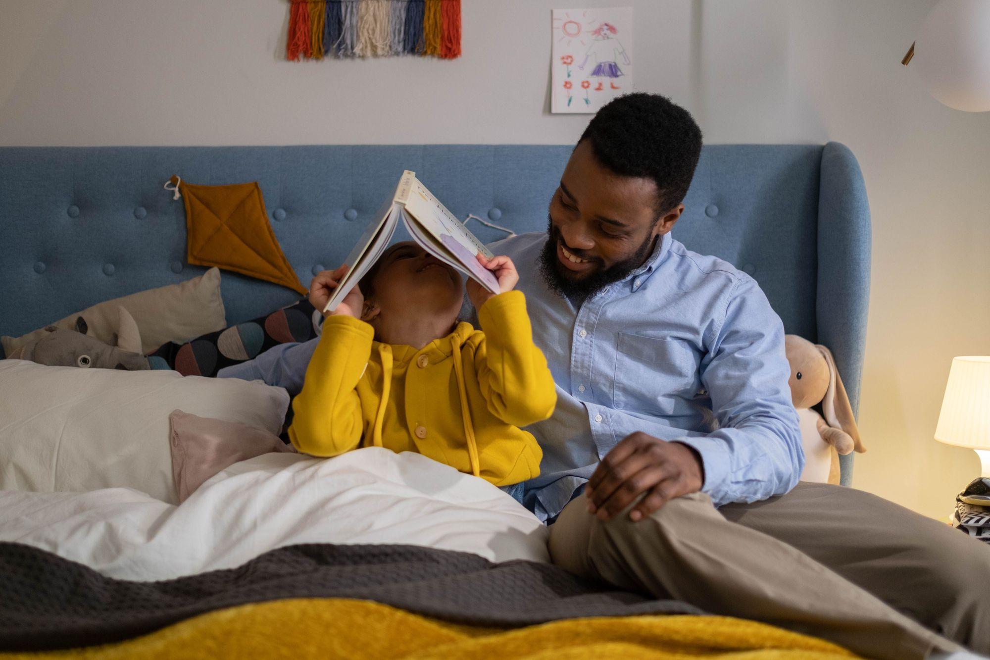 A parent and child sharing a bedtime story together